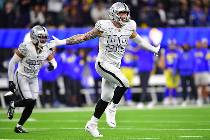 Las Vegas Raiders defensive end Maxx Crosby puts his arms out wide as he runs