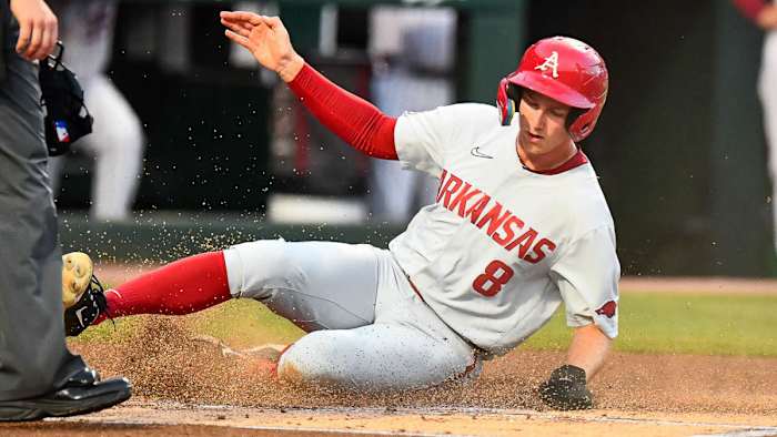 Razorbacks Jace Bohrofren slides across home in Sunday night's game against Santa Clara