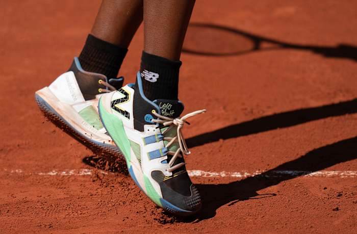 View of Coco Gauff's black and green New Balance shoes at the French Open.