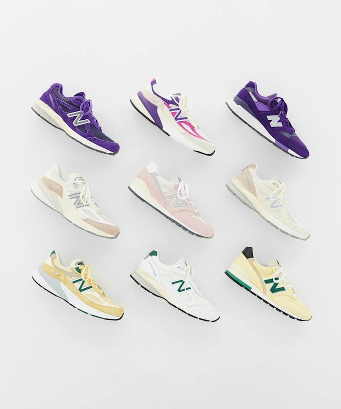 View of nine multicolor New Balance sneakers.