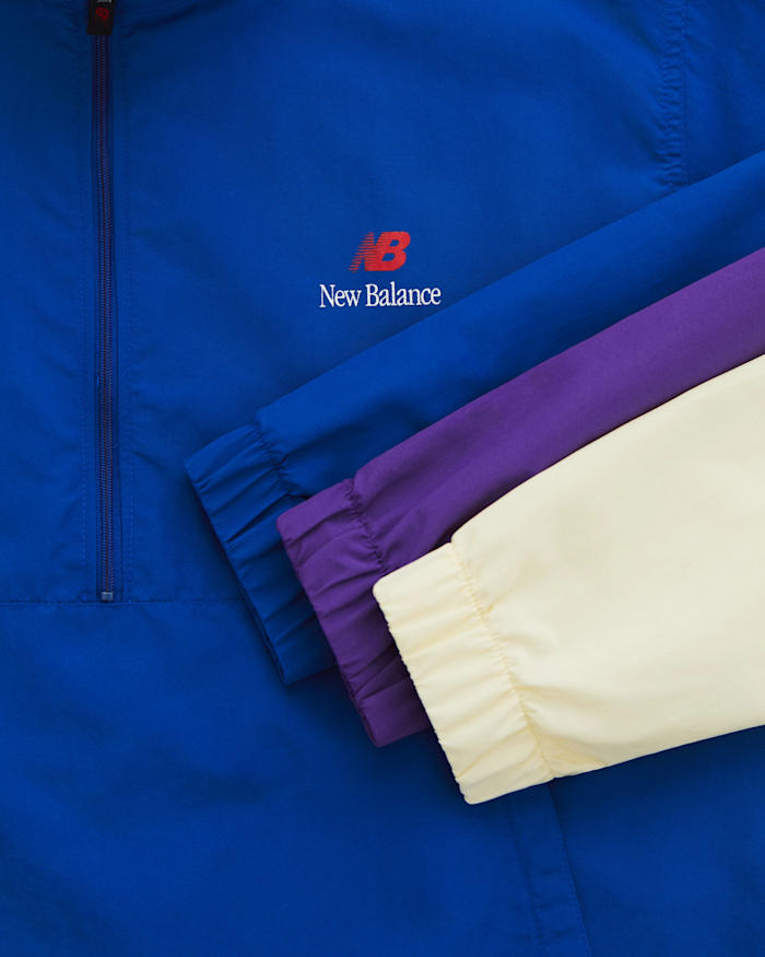 Blue, purple, and cream New Balance sweatshirts.