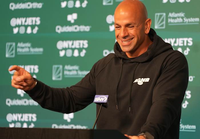 Robert Saleh addresses reporters prior to a May 31 OTAs practice