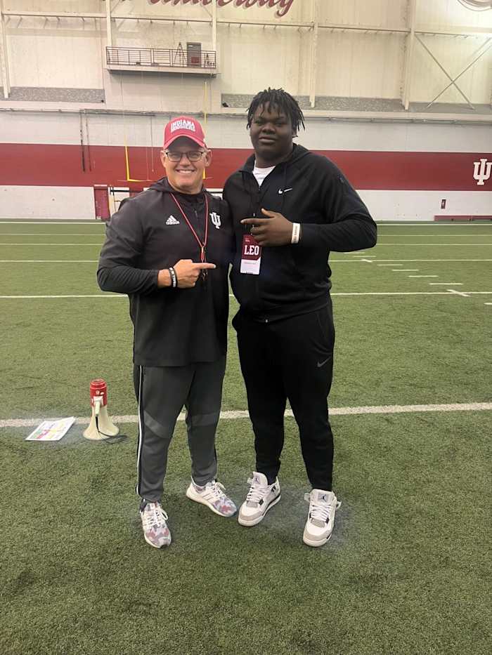 Indiana coach Tom Allen (left) and 2024 offensive lineman commit Adedamola Ajani during a visit on March 28, 2023.