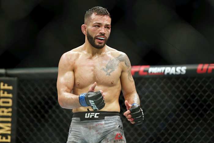 UFC fighter Dan Ige in the middle of a fight inside the Octagon.