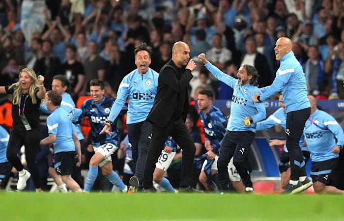 Pep Guardiola pictured (center) seconds after the last whistle had been blown in the 2023 UEFA Champions League final, which saw his Manchester City team beat Inter Milan 1-0