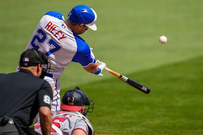 Jun 10, 2023; Cumberland, Georgia, USA; Atlanta Braves third baseman Austin Riley (27) hits a sacrifice fly ball to drive in a run against the Washington Nationals during the first inning at Truist Park. Mandatory Credit: Dale Zanine-USA TODAY Sports