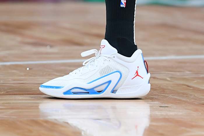 View of Jayson Tatum's white, blue, and red Jordan Brand shoe.