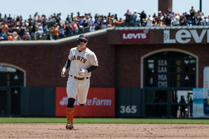 SF Giants designated hitter Joc Pederson runs the bases after hitting a two-run home run against the Chicago Cubs on June 11, 2023.