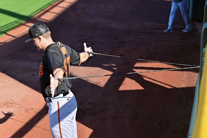 SF Giants starting pitcher Keaton Winn warms up during a Spring Training workout. (2023)