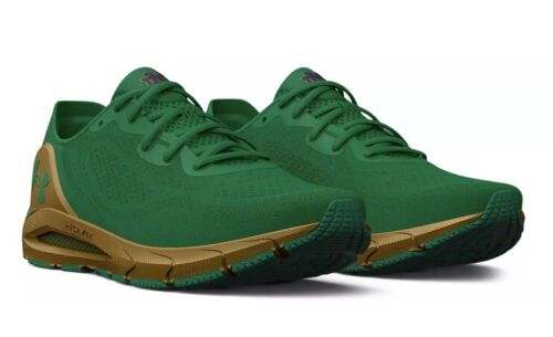 View of green, navy, and gold Under Armour shoes.