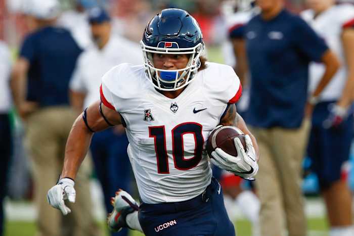 Oct 20, 2018; Tampa, FL, USA; Connecticut Huskies running back Zavier Scott (10) runs the ball during warmups before the game against the South Florida Bulls at Raymond James Stadium.