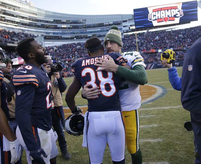 Safety Adrian Amos and quarterback Aaron Rodgers embrace following a 2018 regular season game