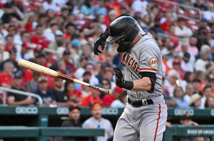 Mitch Haniger winces after Jack Flaherty's pitch breaks his forearm