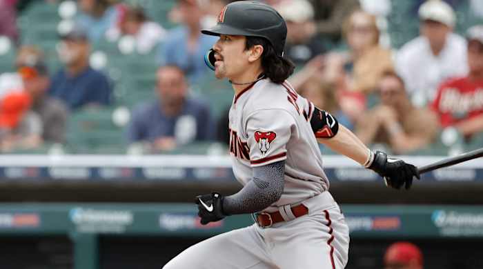 Arizona Diamondbacks left fielder Corbin Carroll looks on as he hits a triple against the Detroit Tigers.