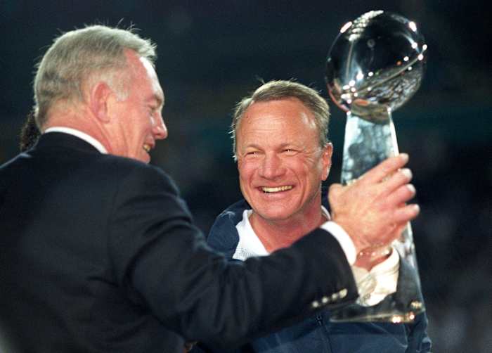 Dallas Cowboys owner Jerry Jones and head coach Barry Switzer hold the Lombardi trophy after a victory against the Pittsburgh Steelers in Super Bowl XXX at Sun Devil Stadium. Dallas defeated Pittsburgh 27-17.
