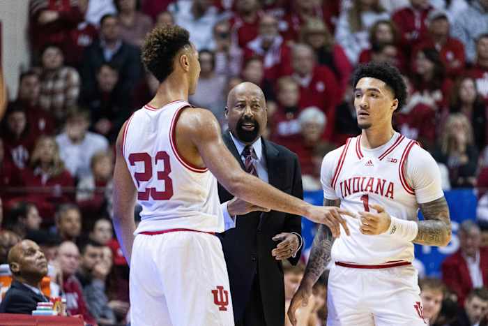 Indiana Hoosiers head coach Mike Woodson talks with Indiana Hoosiers forward Trayce Jackson-Davis (23) and guard Jalen Hood-Schifino (1) in the first half against the Michigan State Spartans at Simon Skjodt Assembly Hall.