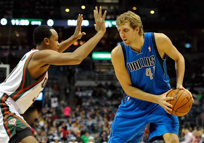 Milwaukee Bucks forward John Henson (31) guards Dallas Mavericks forward Dirk Nowitzki (41)