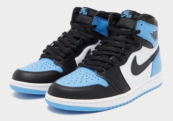 Side view of blue, black, and white Air Jordan sneakers.