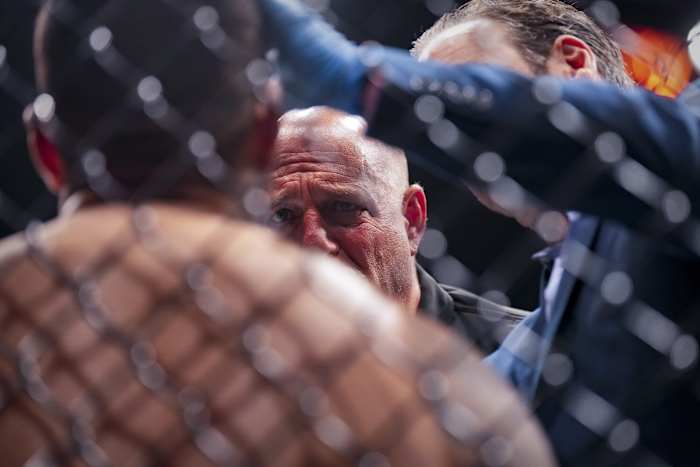 Referee Dan Miragliotta and the Octagon-side doctor check on Justin Tafa's eye during UFC Jacksonville.