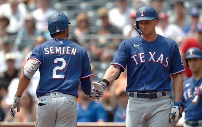 May 24, 2023; Pittsburgh, Pennsylvania, USA; Texas Rangers designated hitter Corey Seager (right) greets second baseman Marcus Semien (2) after hitting a solo home run against the Pittsburgh Pirates during the first inning at PNC Park. Mandatory Credit: Charles LeClaire-USA TODAY Sports
