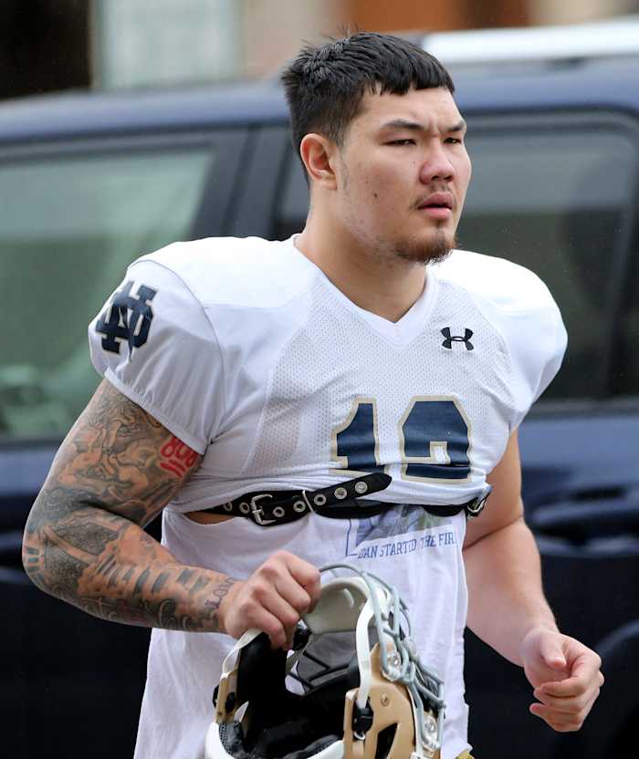 Senior edge rusher Jordan Botelho (12) walks into spring practice Saturday, March 25, 2023, at Notre Dame in South Bend. Nd Fb Practice 03252023