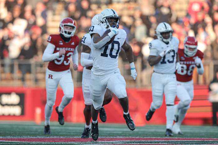 Penn State running back Nicholas Singleton returns a kickoff for a touchdown against Rutgers.