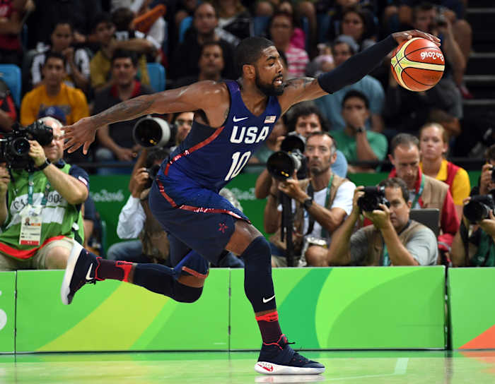 USA guard Kyrie Irving grabs a loose ball during the 2016 Summer Olympic Games.
