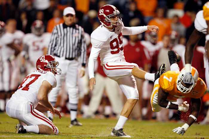 Alabama Crimson Tide kicker Leigh Tiffin (99) watches the flight of the ball after kicking a field goal against the Tennessee Volunteers in the second half at Neyland Stadium. Alabama defeated Tennessee 29-9.
