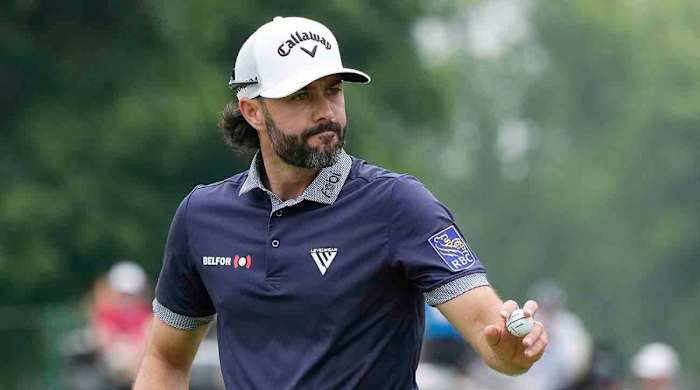Adam Hadwin acknowledges the crowd during the 2023 Rocket Mortgage Classic.