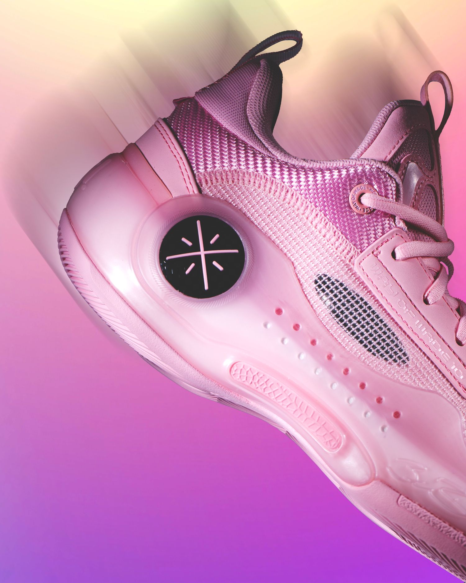 Side view of Dwyane Wade's pink basketball shoes.