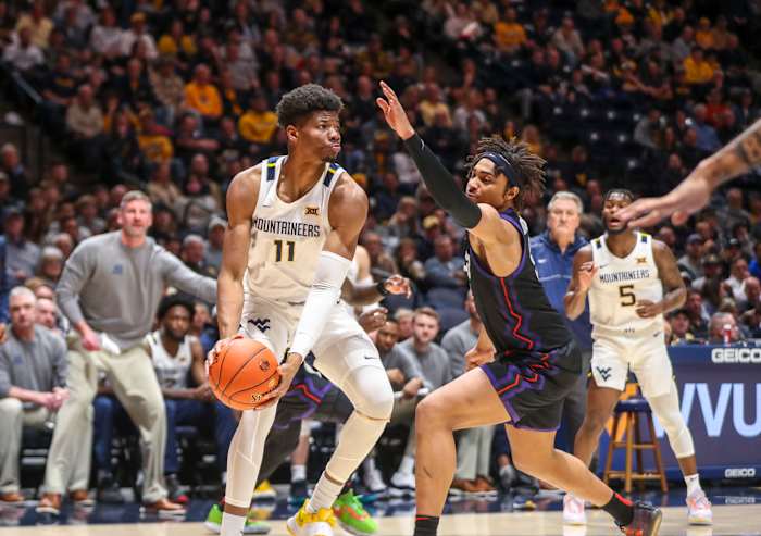 Jan 18, 2023; Morgantown, West Virginia, USA; West Virginia Mountaineers forward Mohamed Wague (11) looks to pass during the second half against the TCU Horned Frogs at WVU Coliseum. Mandatory Credit: Ben Queen-USA TODAY Sports
