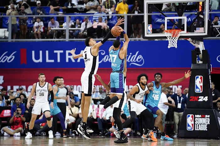 San Antonio Spurs forward Victor Wembanyama (1) attempts to block a shot from Charlotte Hornets guard Amari Bailey (17) during the second half at Thomas & Mack Center.