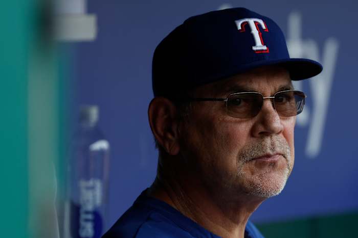 Rangers manager Bruce Bochy looks on from the dugout against the Washington Nationals during the second inning at Nationals Park.
