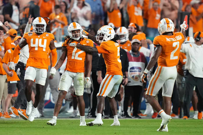 Dec 30, 2022; Miami Gardens, FL, USA; Tennessee Volunteers defensive back Tamarion McDonald (12) celebrates with defensive back Kamal Hadden (5) after intercepting a pass during the second half of the 2022 Orange Bowl against the Clemson Tigers at Hard Rock Stadium.