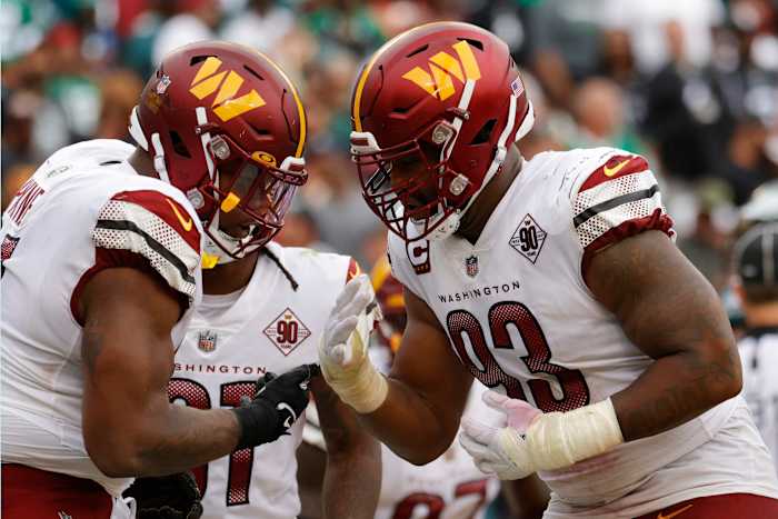 Washington Commanders defensive tackle Daron Payne (94) celebrates with Commanders defensive tackle Jonathan Allen (93) after a safety against the Philadelphia Eagles at FedExField.