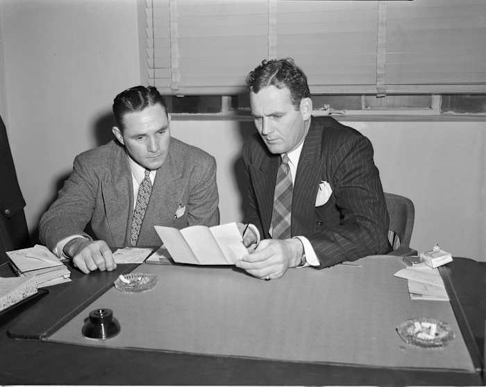 Former Alabama player Frank Mosely (left), who returned to Kentucky as an assistant coach, welcomed Paul "Bear" Bryant to his new position as Kentucky head coach in 1946.