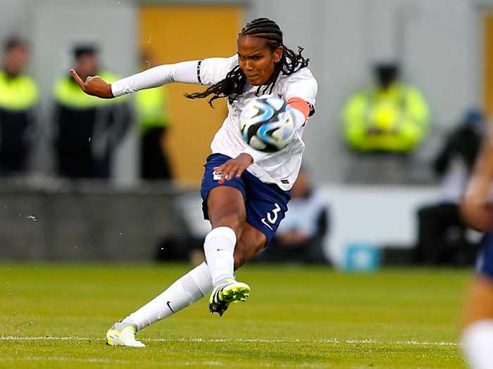 France defender Wendie Renard hits a shot on goal in a friendly against Ireland.