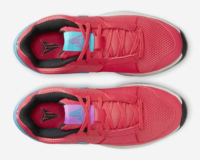 View of Ja Morant's red, blue, and white Nike shoes.