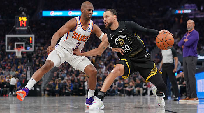 Chris Paul defends Steph Curry.