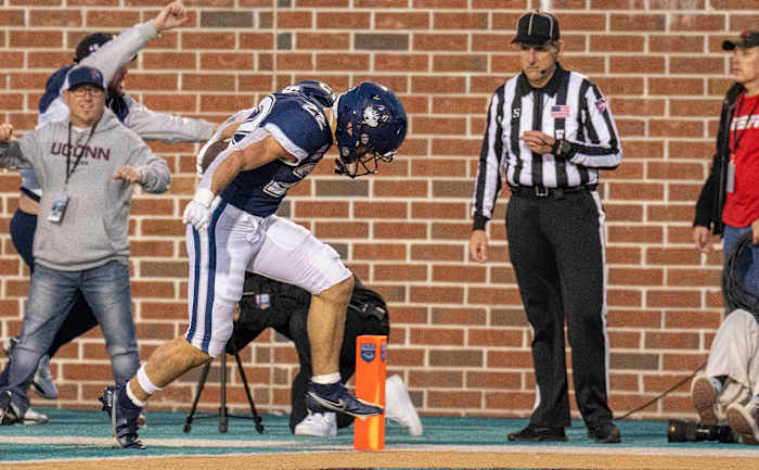 Dec 19, 2022; Conway, South Carolina, USA; Connecticut Huskies running back Victor Rosa (22) leans across the goal line in the second half against the Marshall Thundering Herd at Brooks Stadium. Mandatory Credit: David Yeazell-USA TODAY Sports