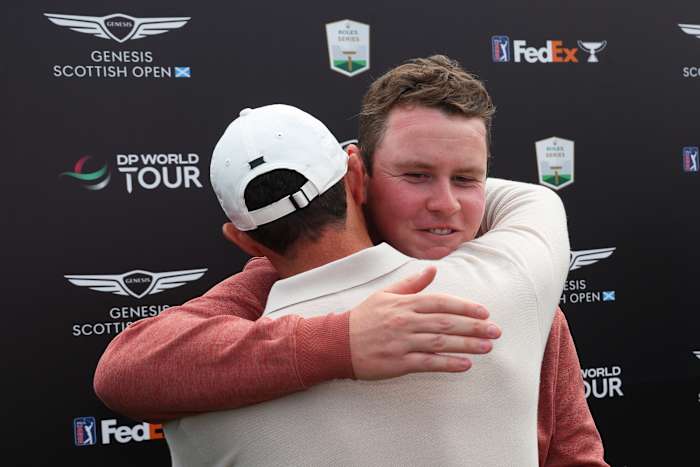 Champion, Rory McIlroy of Northern Ireland and runner-up, Robert MacIntyre of Scotland embrace during Day Four of the Genesis Scottish Open at The Renaissance Club on July 16, 2023 in United Kingdom.