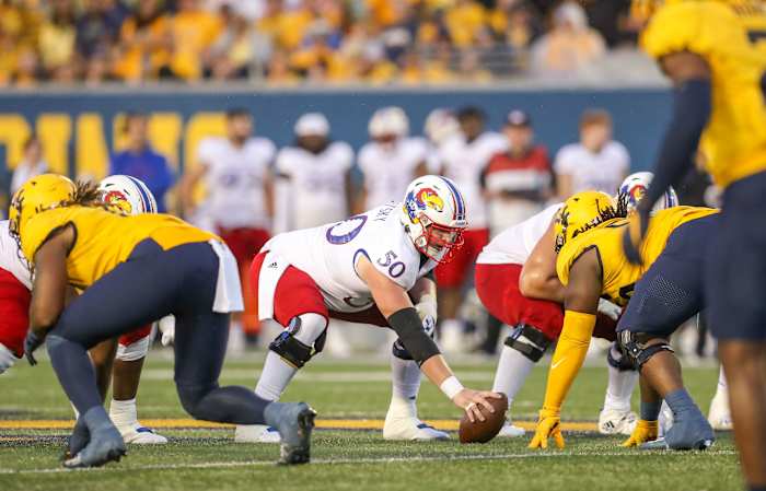 Sep 10, 2022; Morgantown, West Virginia, USA; Kansas Jayhawks offensive lineman Mike Novitsky (50) over center during the second quarter against the West Virginia Mountaineers at Mountaineer Field at Milan Puskar Stadium. Mandatory Credit: Ben Queen-USA TODAY Sports