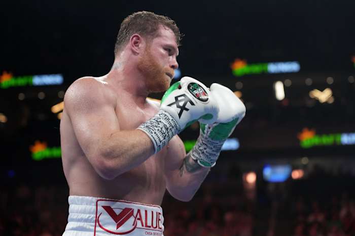 Canelo Alvarez in the middle of a boxing title fight against Gennady Golovkin.