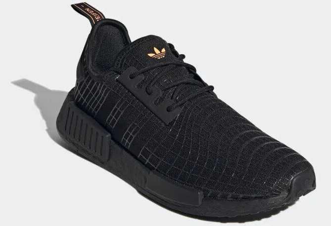 Side view of black adidas sneakers.