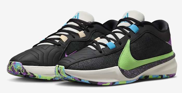 Side view of Giannis Antetokounmpo's black, green, and blue Nike shoes.