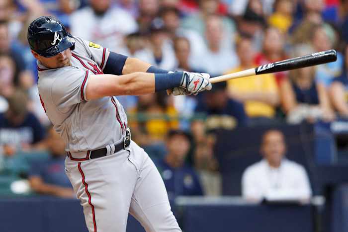 Jul 21, 2023; Milwaukee, Wisconsin, USA; Atlanta Braves third baseman Austin Riley (27) hits a home run during the third inning against the Milwaukee Brewers at American Family Field.