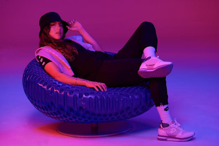 Sofia Huerta models Lotto Brand apparel.