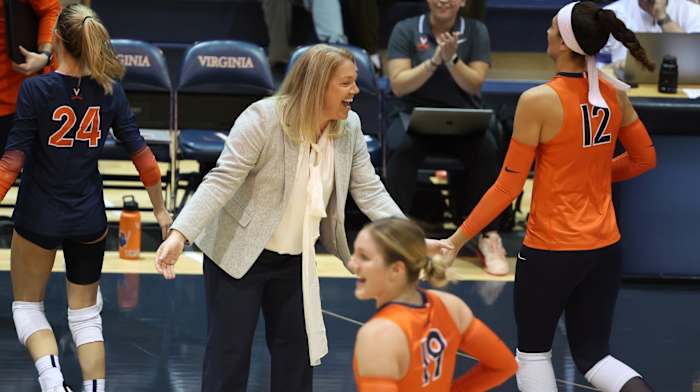 Head coach Shannon Wells congratulates her team during the Virginia volleyball match against Pittsburgh at Memorial Gymnasium.
