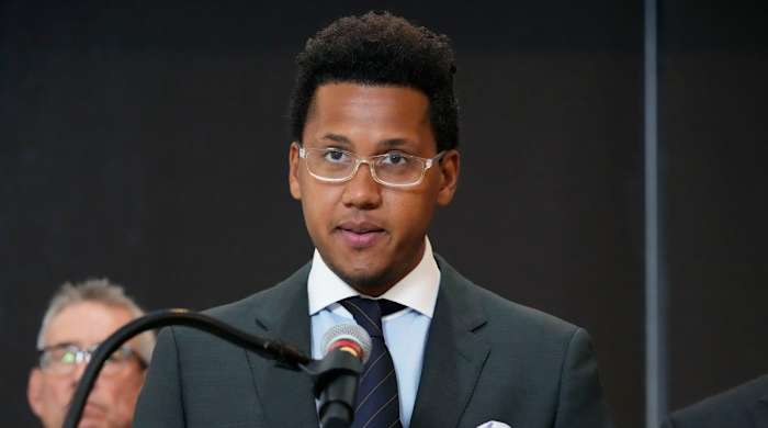 Former Northwestern quarterback Lloyd Yates speaks at a news conference about the hazing lawsuits facing the school.