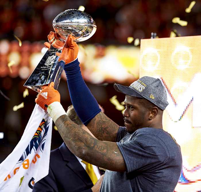 Von Miller holding the Lombardi Trophy after winning Super Bowl 50 with the Broncos